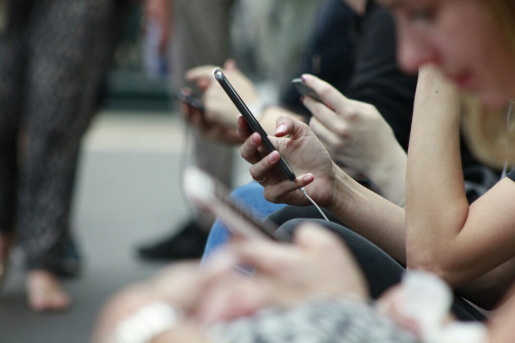 People on their phones — why we need screen-free activities